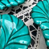 Salad bowl and small bowls in leaf-shaped slipware