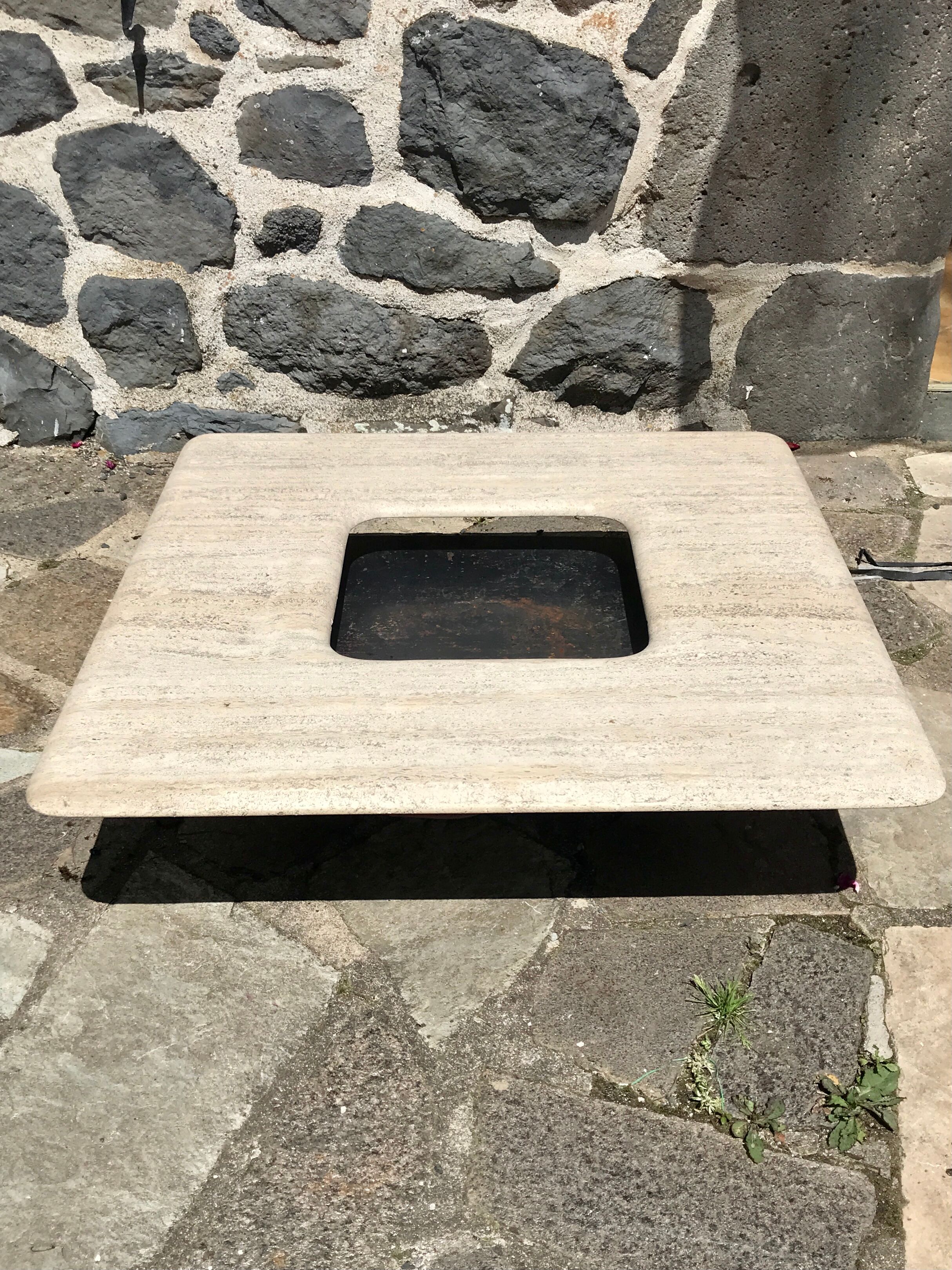 Sculptural travertine coffee table