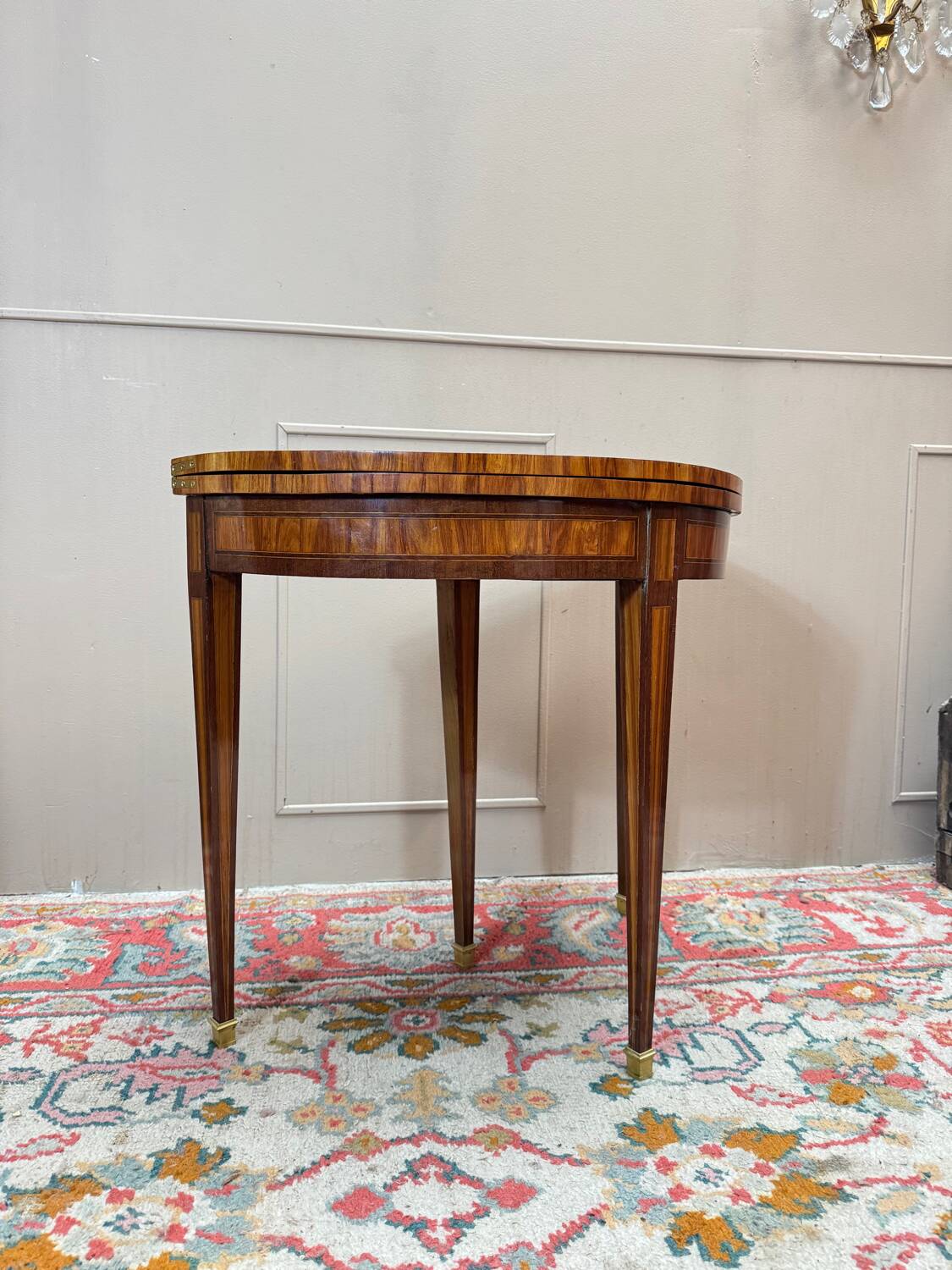 Half-moon game table in marquetry from the Louis XVI period, 18th century.