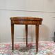 Half-moon game table in marquetry from the Louis XVI period, 18th century.