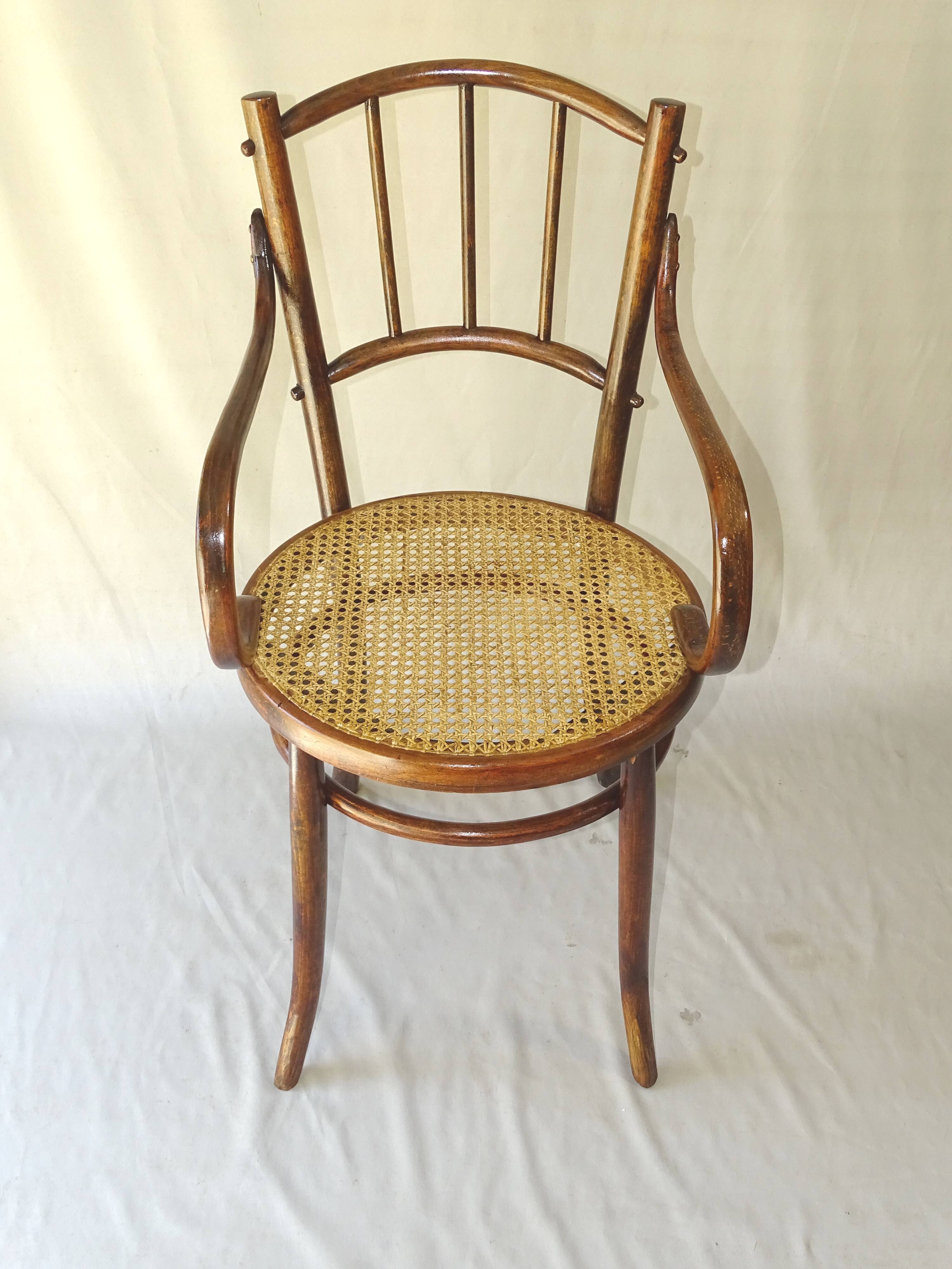 Small canned armchair; in curved wood, bistro, 1890