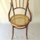Small canned armchair; in curved wood, bistro, 1890