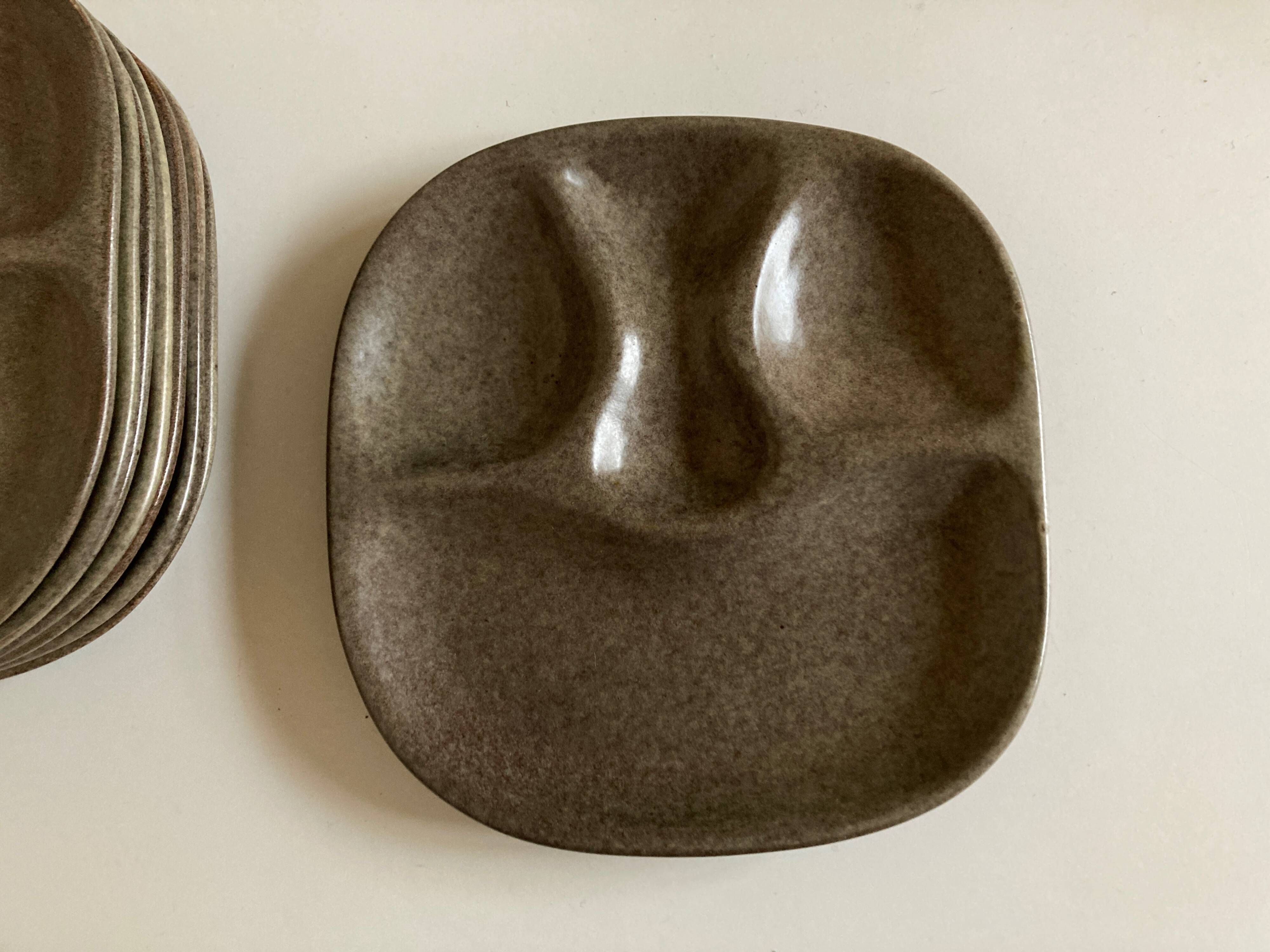 Set of 8 mid century modern stoneware potter's plates to identify