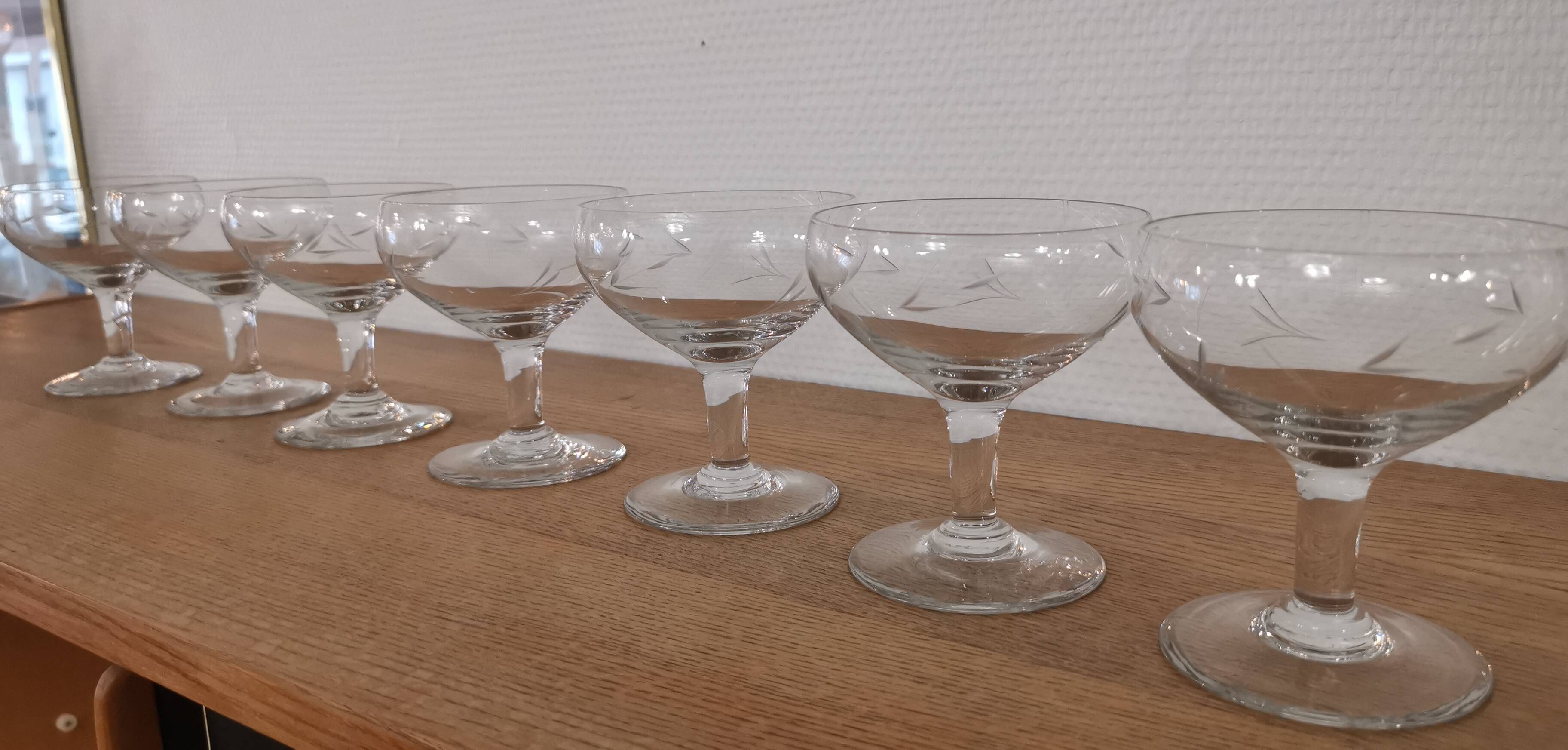 Set of 7 vintage engraved champagne glasses