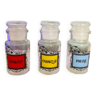 Three small airtight glass spice jars