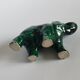 Small emerald green ceramic elephant.