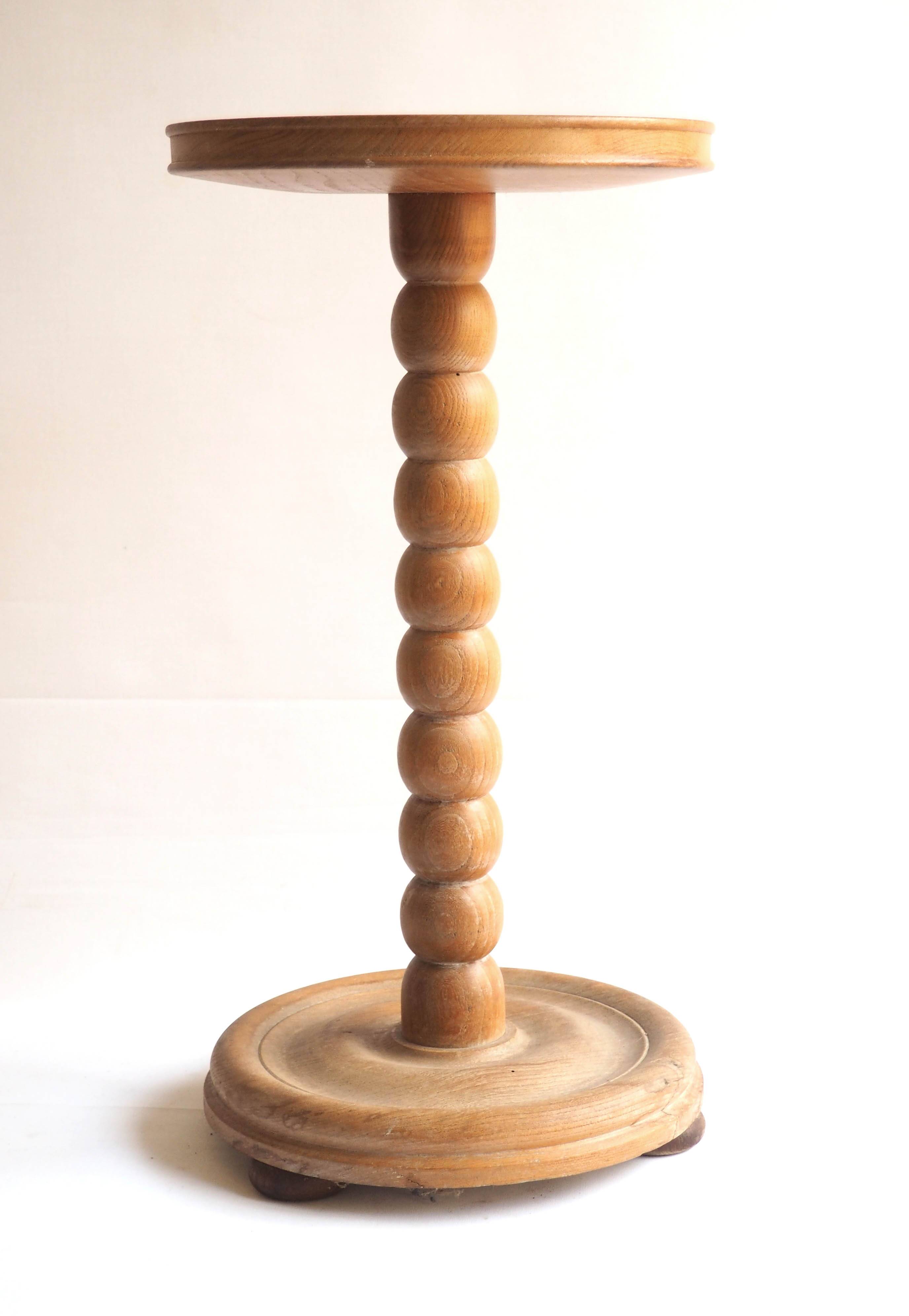 Beaded wood pedestal table