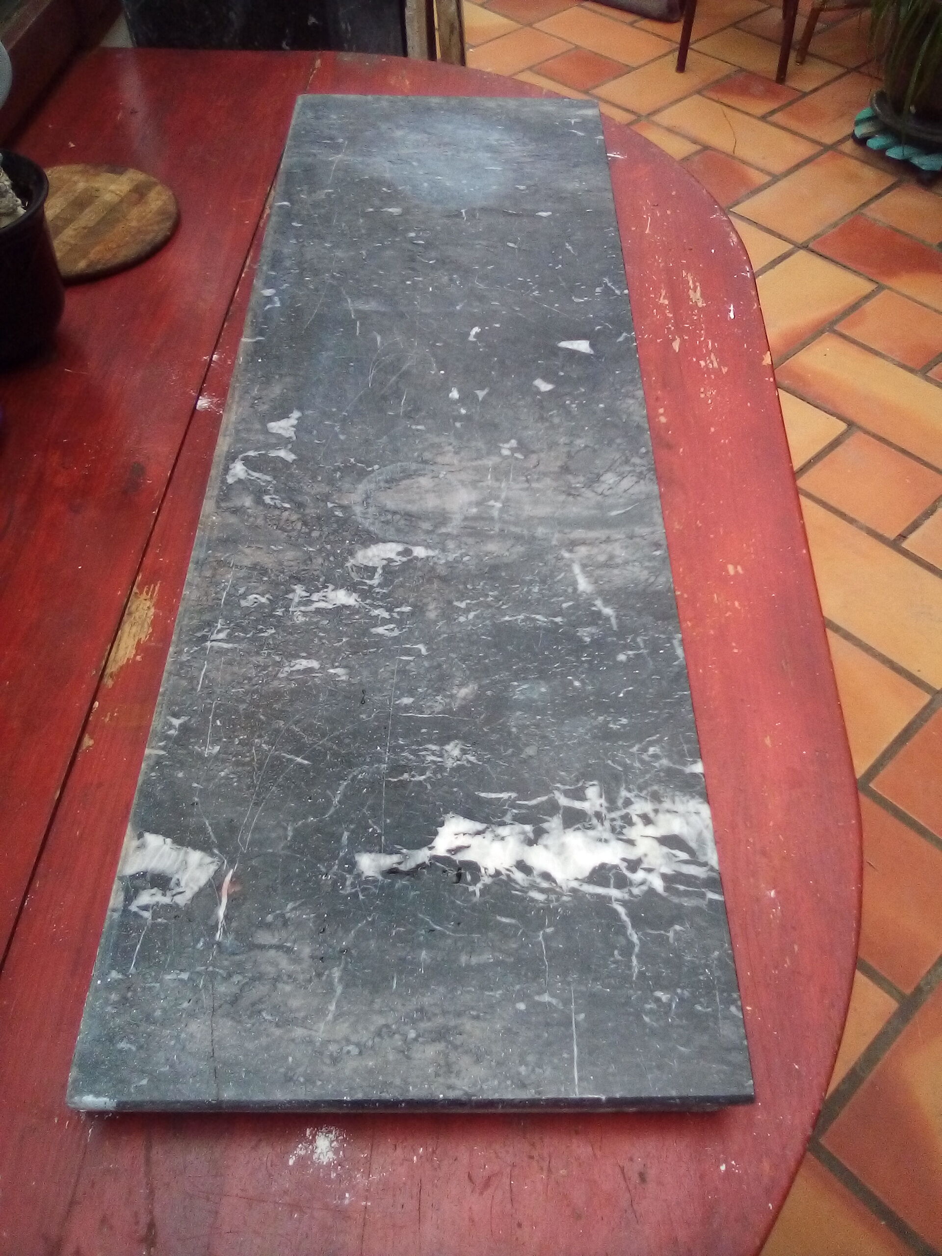 White veined black marble fireplace