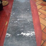 White veined black marble fireplace