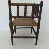 Corner chair in turned wood and straw