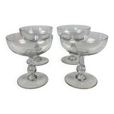 4 Baccarat crystal champagne coupes in a gondola shape.