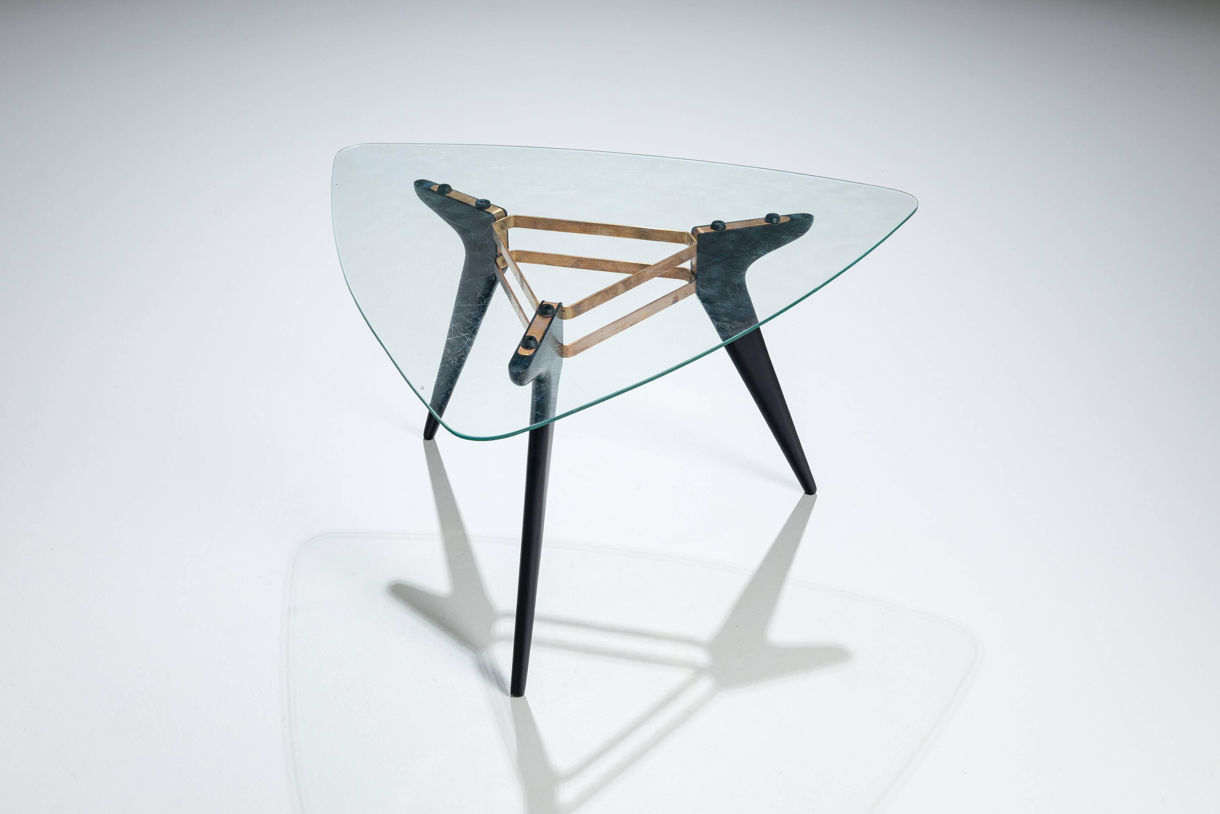 Triangular coffee table in the manner of Alfred Hendrickx