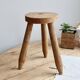 Vintage tripod stool in light raw wood