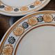 10 dessert plates Saint Amand Amandinoise frilled with orange and black flowers.