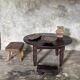 Antique round coffee table in Indonesian teak with turned legs.