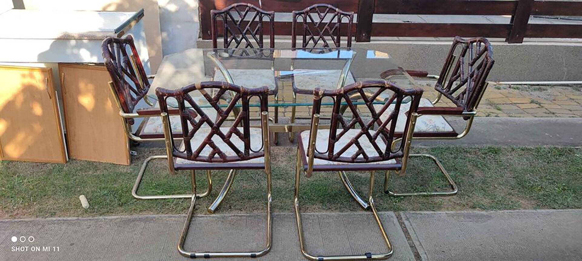 Vintage 1970s set in gilded brass, glass table and 6 brown and straw yellow chairs.