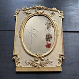 Napoleon III mirror in carved gilded wood, oval mercury glass.