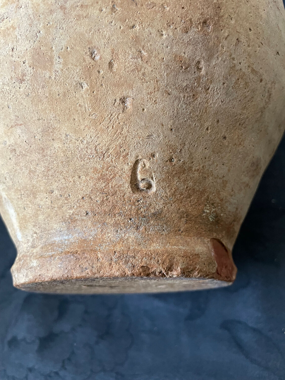 Old candied pot in yellow glazed terracotta