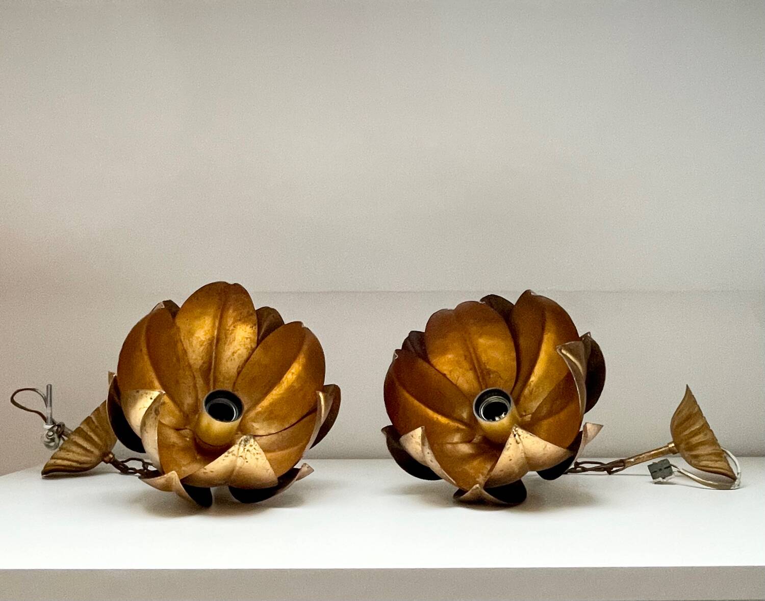 Two vintage pendant lights in gold metal