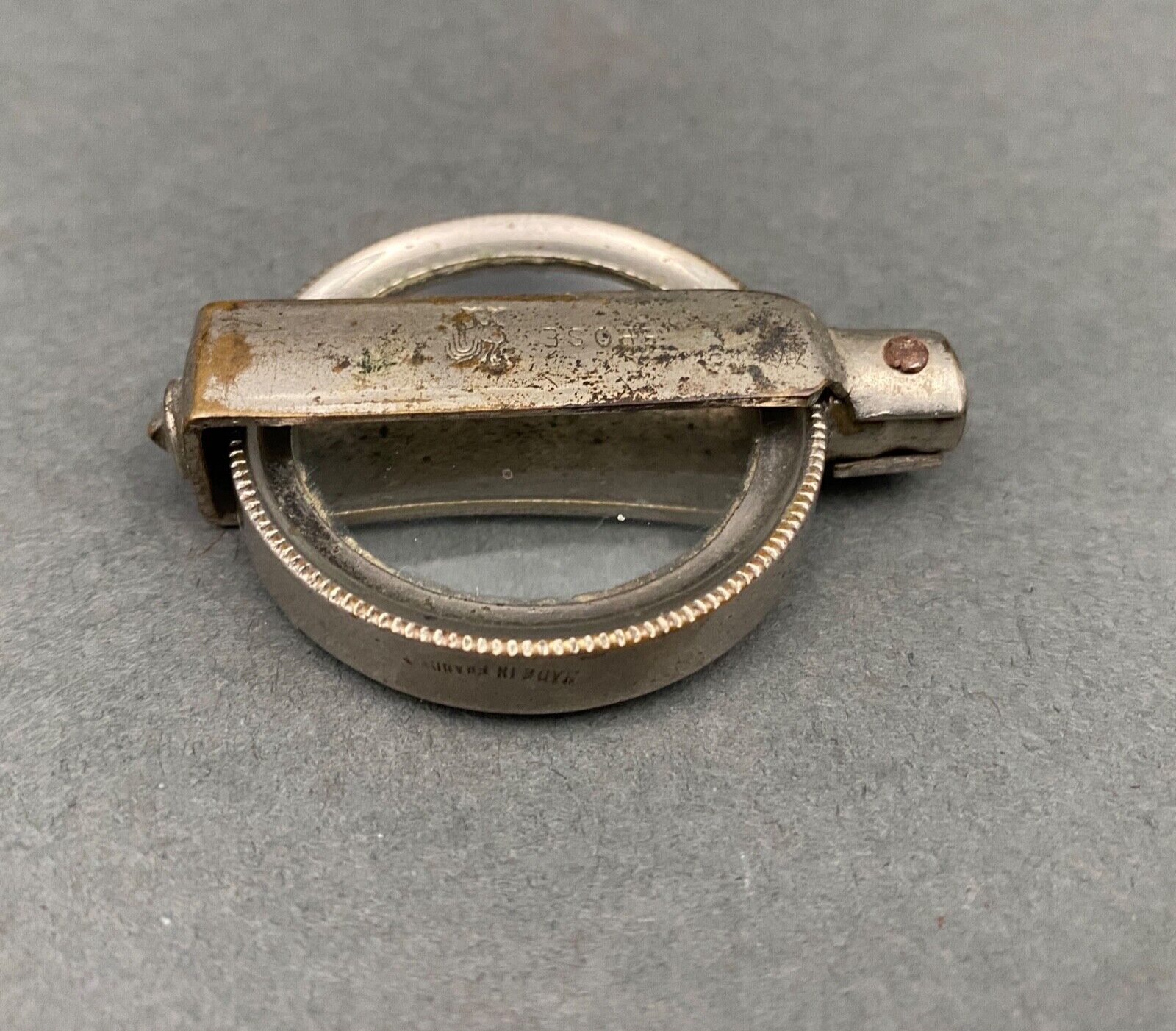 Foldable magnifying glass in silver metal 1900