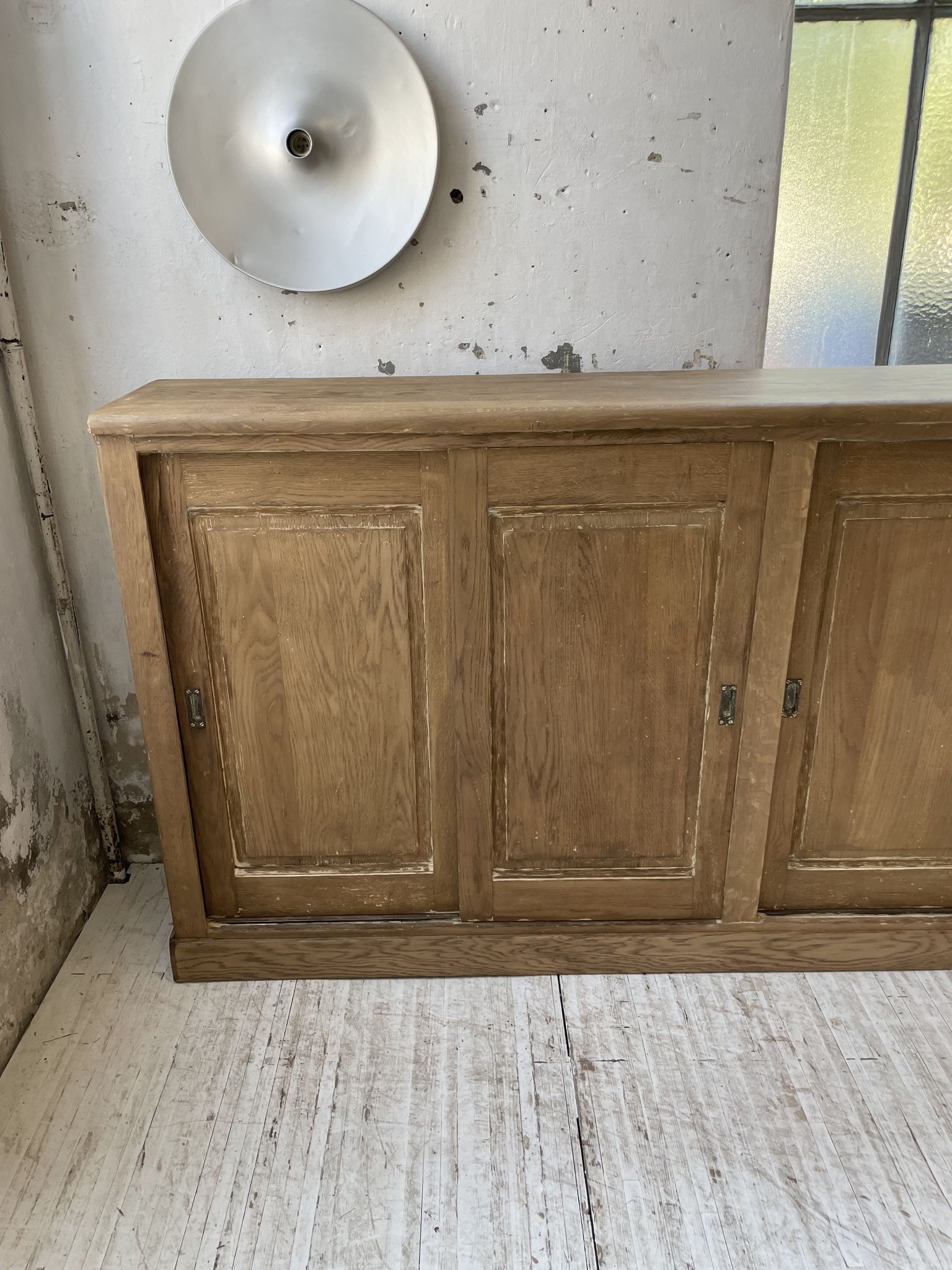Large row of solid oak loom sliding doors