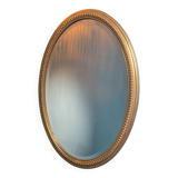 Vintage beveled gold oval mirror