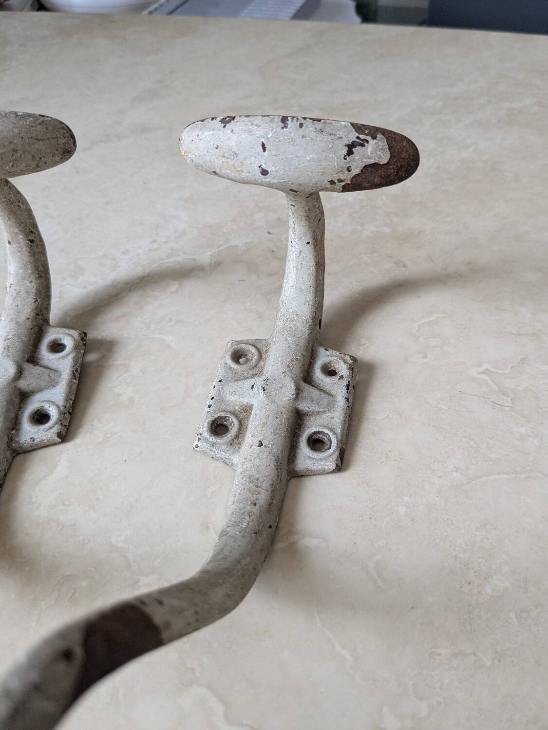 Two vintage coat hooks
