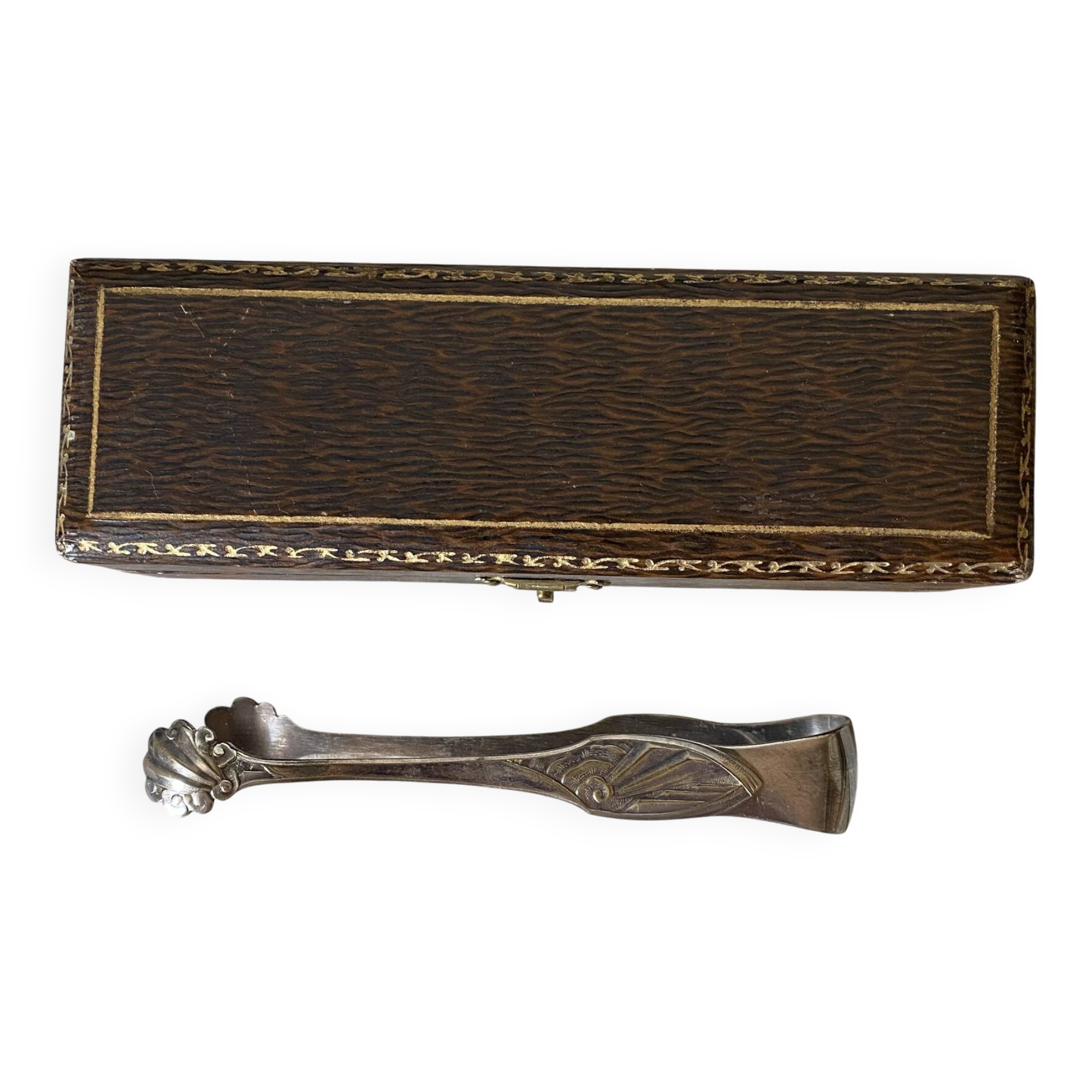 Antique sugar tongs in its case, shell decoration.
