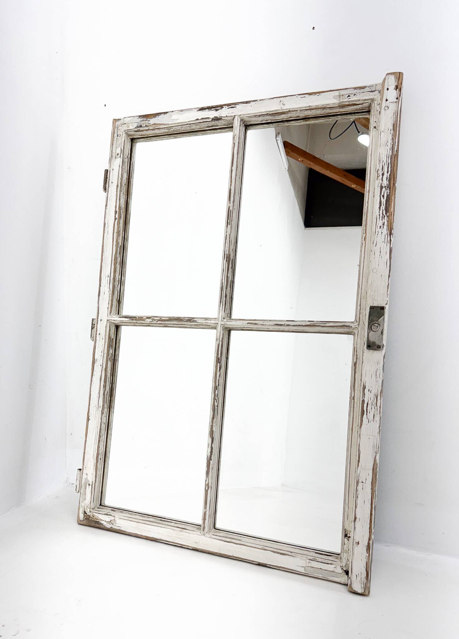 Vintage wooden window converted to a mirror