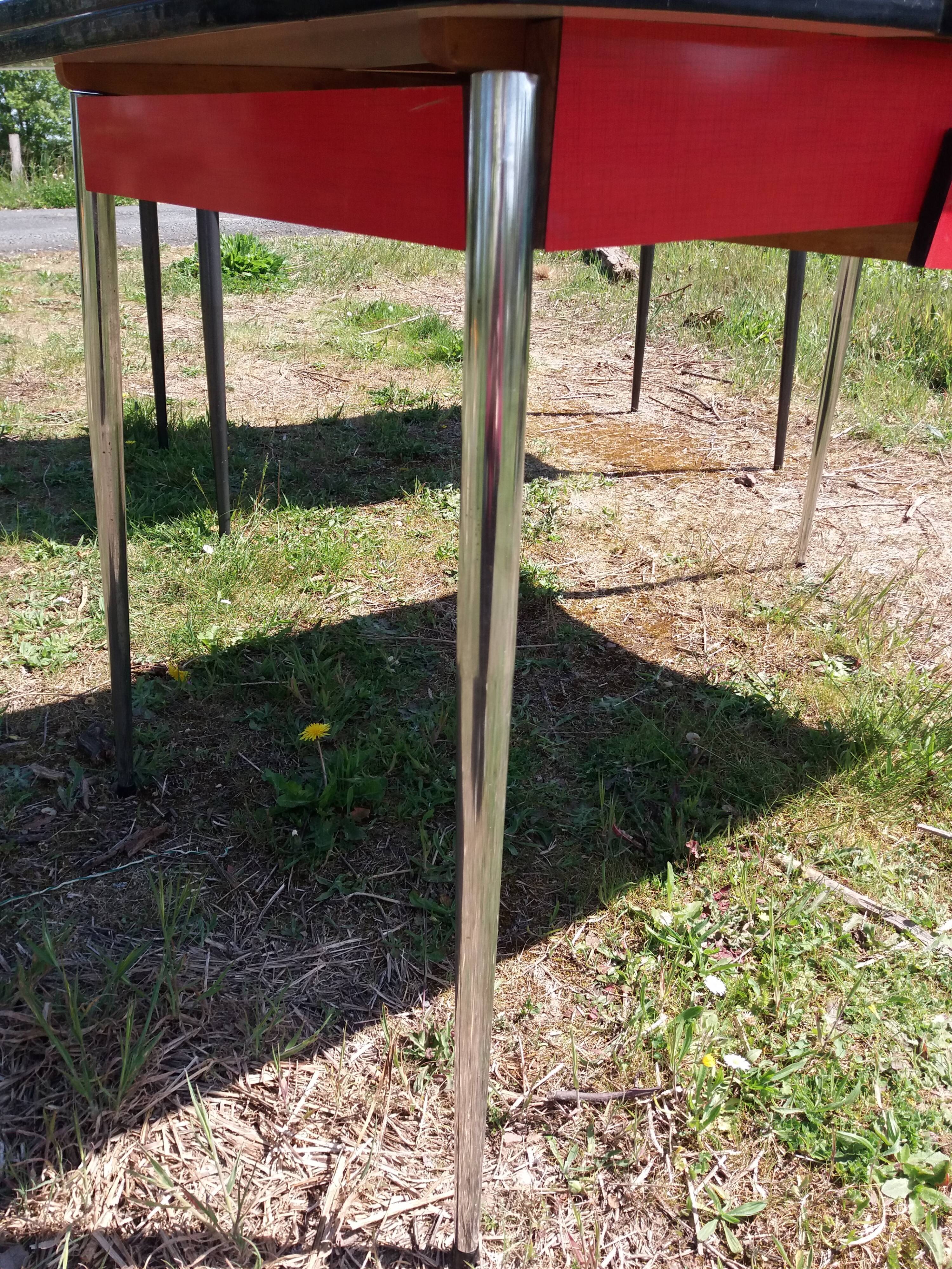 Dining table with red formica extensions