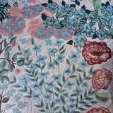 pair of toad armchairs in floral fabric.