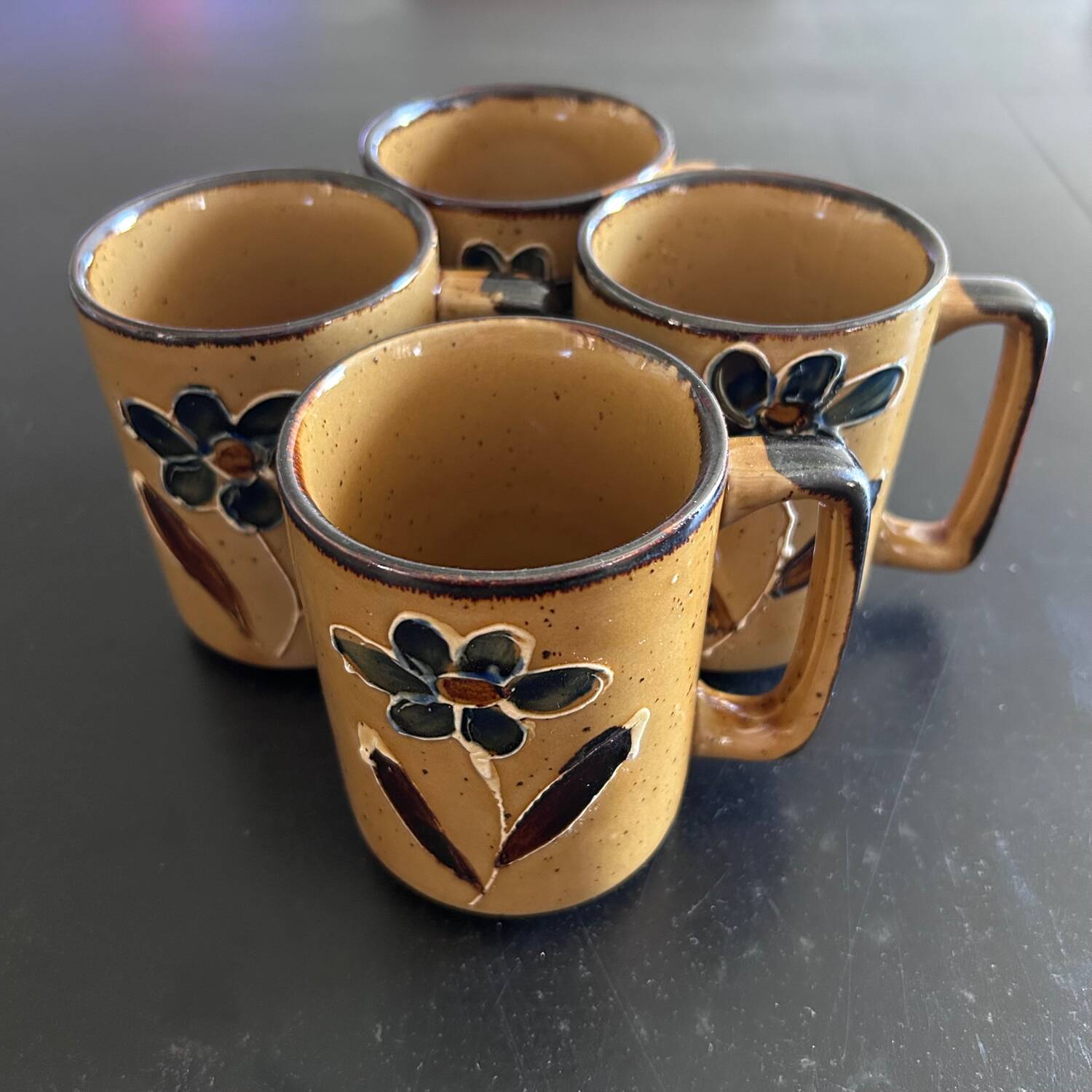Set of 4 floral decorated mugs