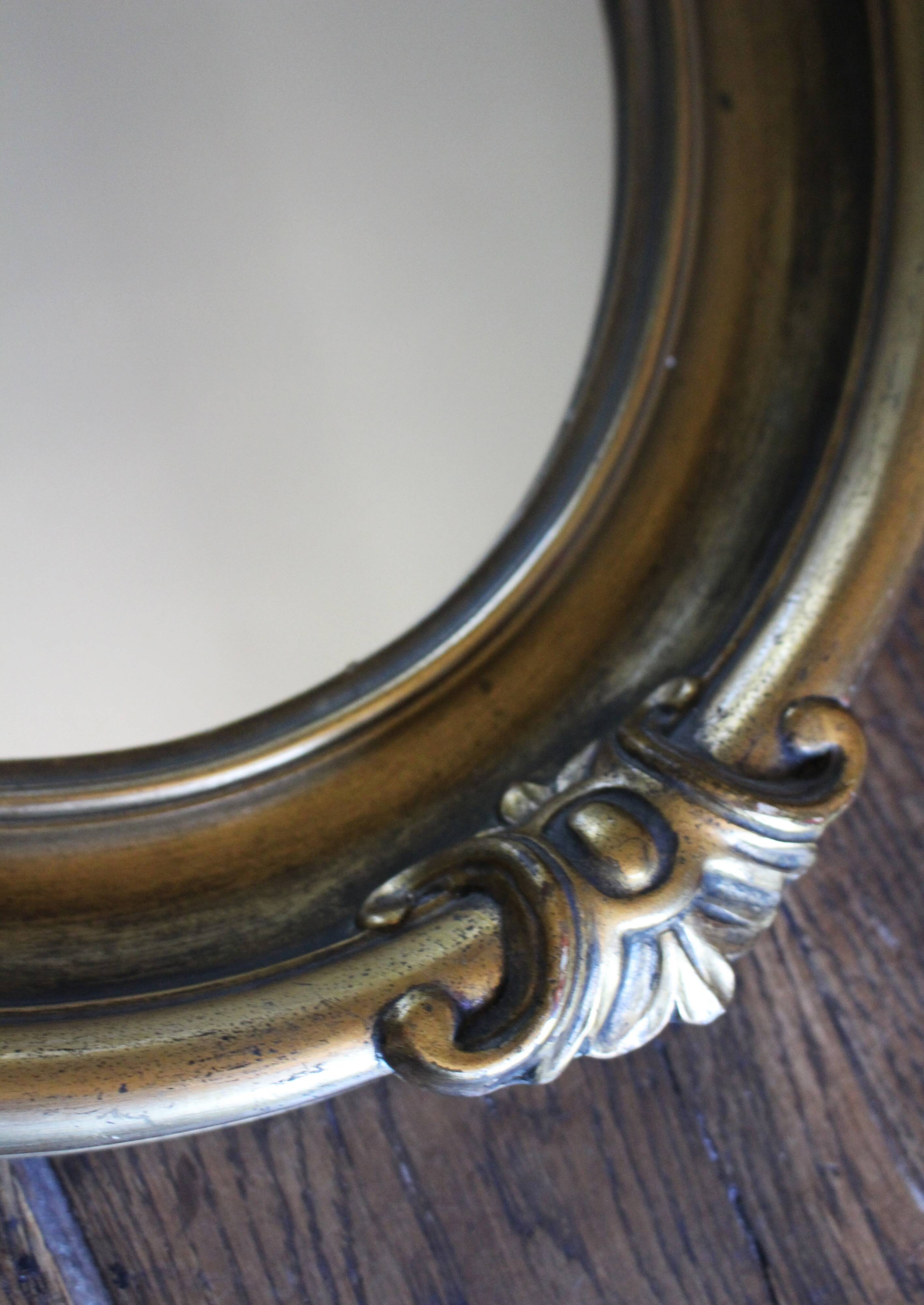 Golden Oval Mirror with Bow and Roses Decor