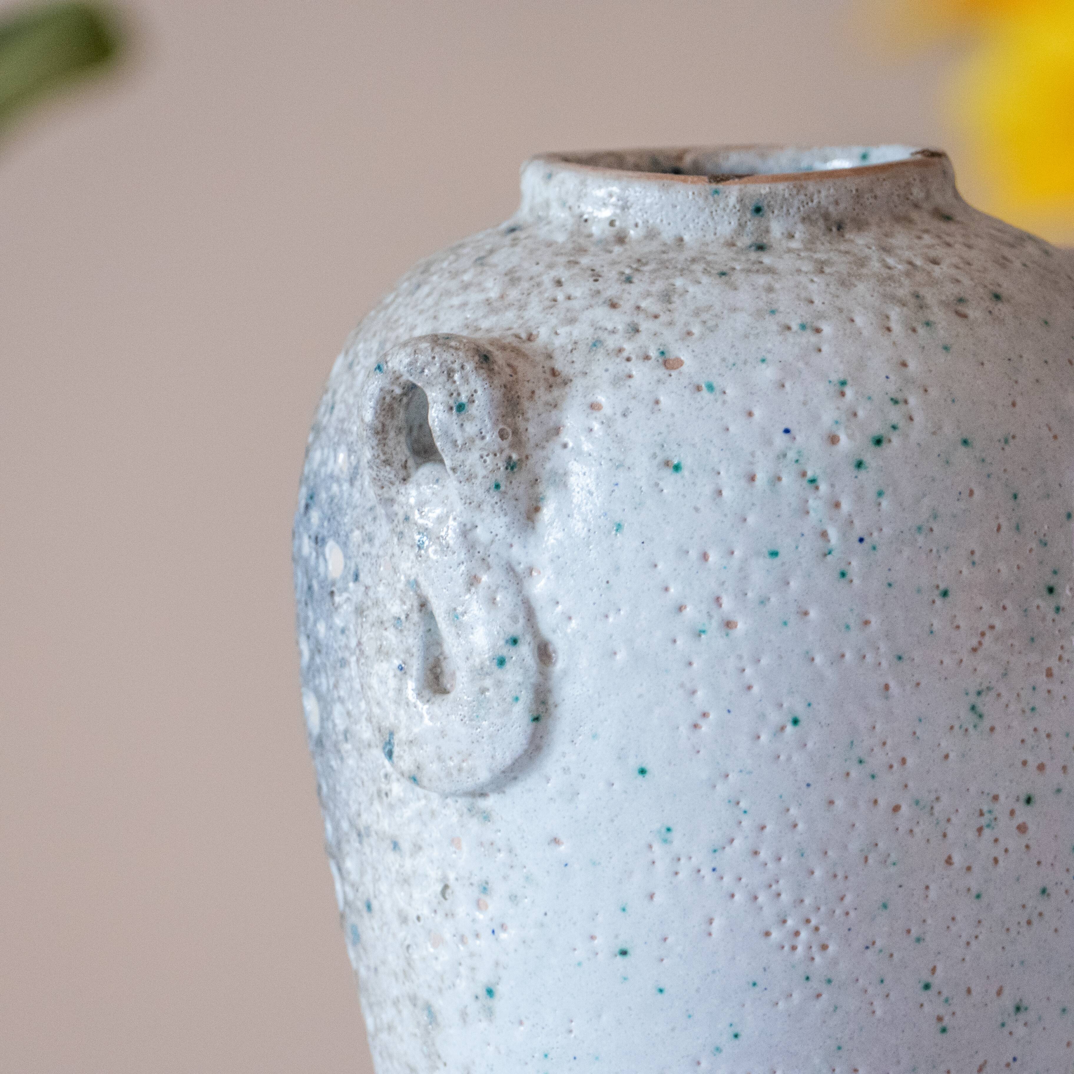 Old foam-glazed terracotta vase