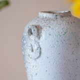 Old foam-glazed terracotta vase