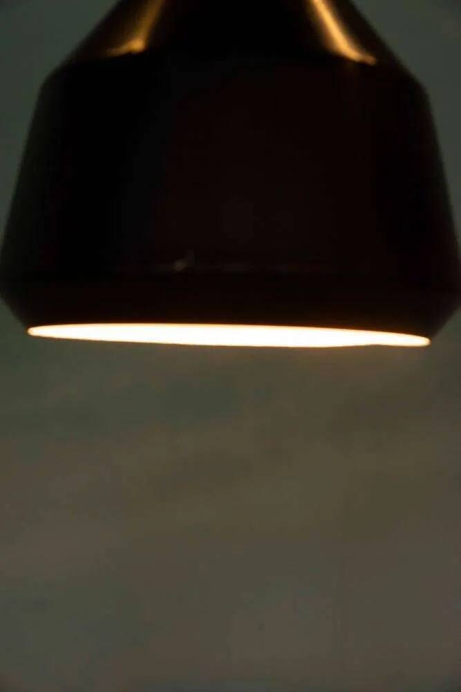 Vintage pendant light design, retro black and white ambient lamp.