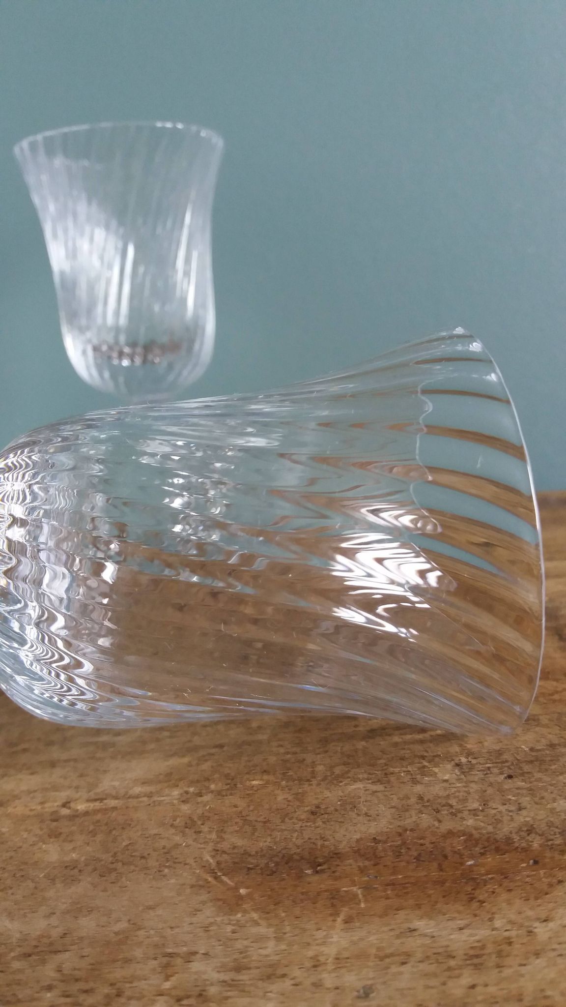 Ancient footed crystal glasses with relief twisted fluted goblets.