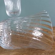 Ancient footed crystal glasses with relief twisted fluted goblets.