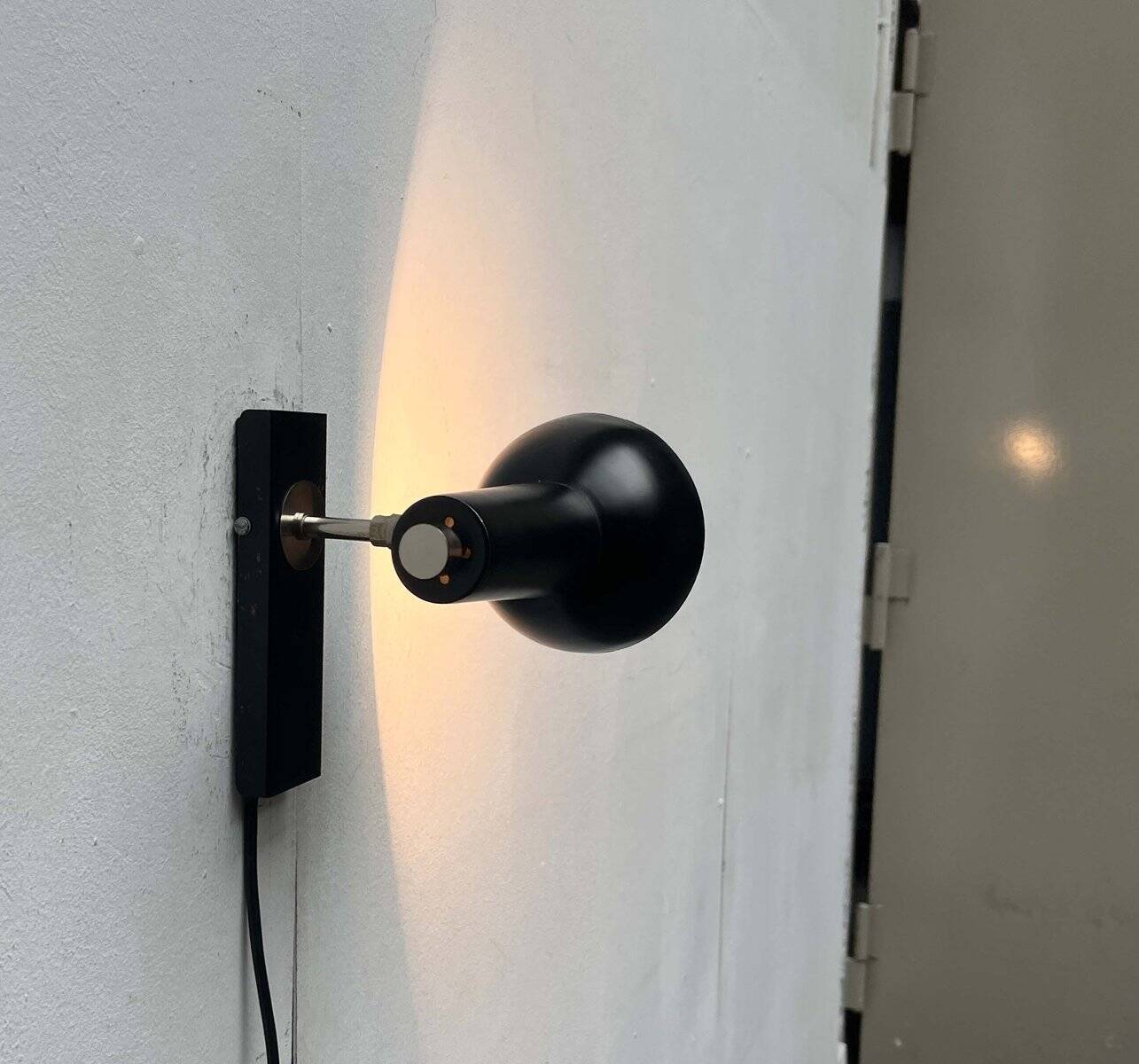 Mid-century German black minimalist wall lamp by Hustadt, 1960s.