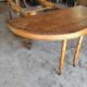 Oval oak table with carved details - known as a hunting table.