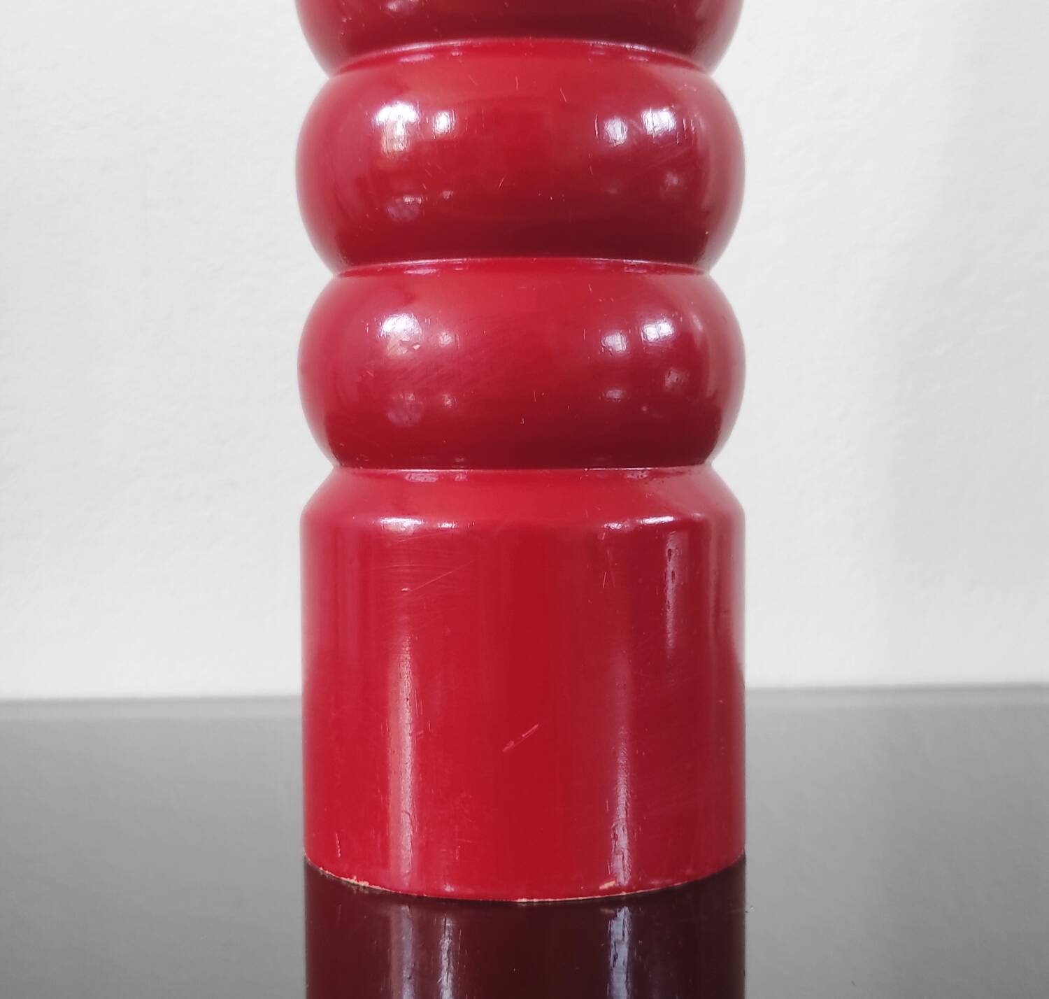 Giant vintage red lacquered wooden pepper mill
