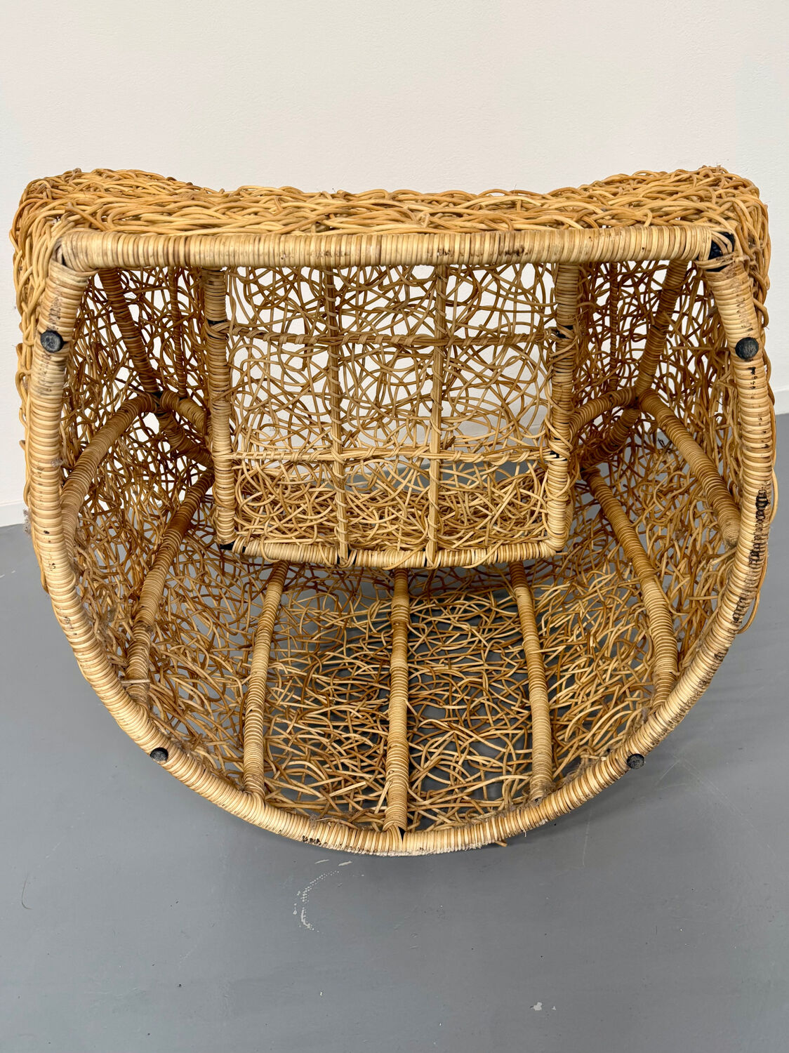 Sculptural woven rattan armchair, organic design from the 1970s.