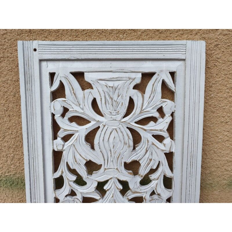 Decorative wooden panel with carved and openwork design.