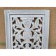 Decorative wooden panel with carved and openwork design.