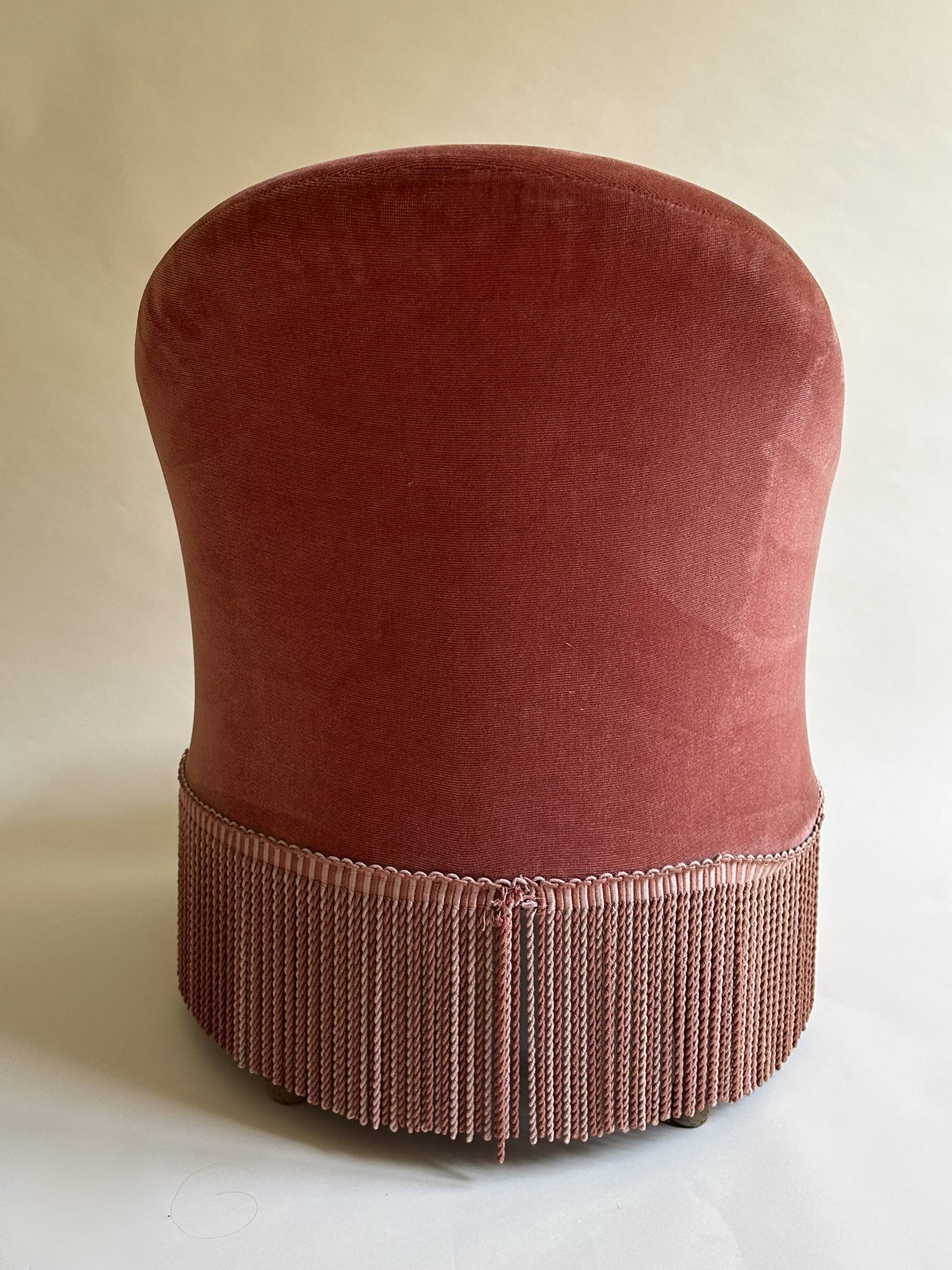 Pink-orange velvet tub chair