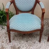 Paire de fauteuils médaillon style Louis XVI