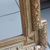 Antique mirror in wood and gilded stucco, neo Louis XVI style.