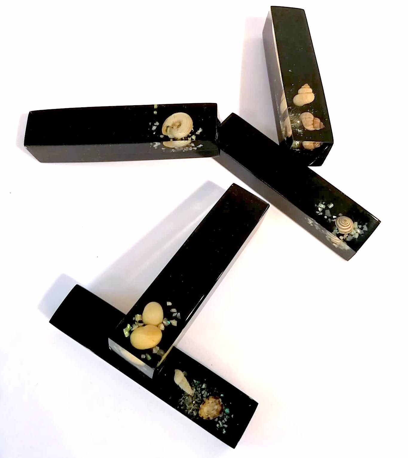 Set of 11 blackened resin knife holders, 1970s