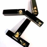 Set of 11 blackened resin knife holders, 1970s