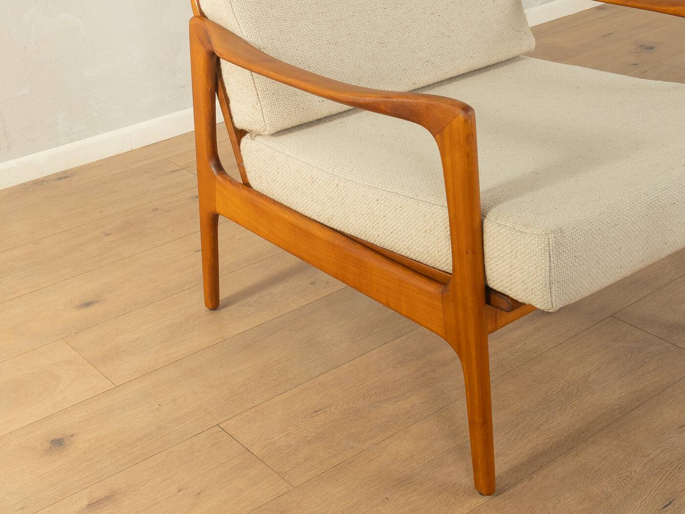 Elegant mid-century armchair from the 1960s with cream-white upholstery